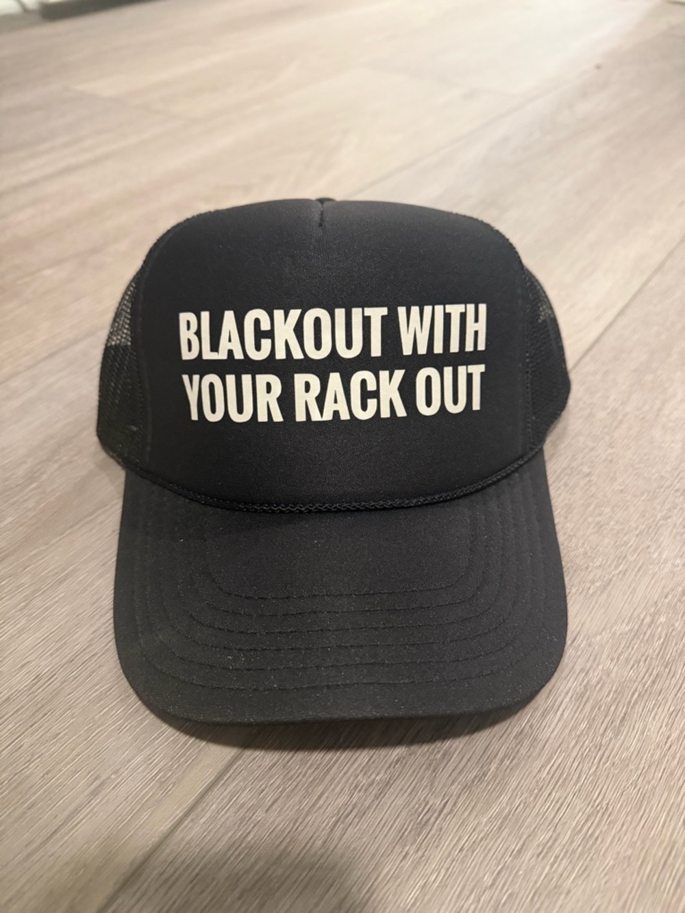 Black Trucker Hat with White Slogan